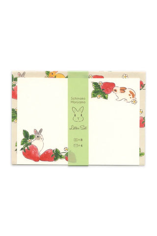Product packaging with rabbit and strawberry illustrations and a green label on a white background