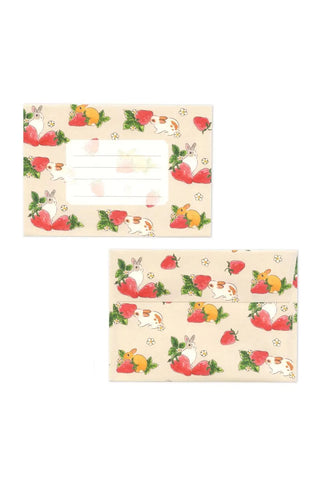 Two decorative paper sheets with fruit and animal illustrations on a white background