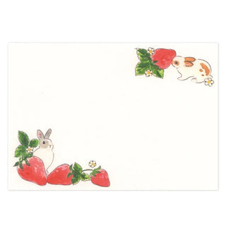 Illustration of bunnies with strawberries on a white background