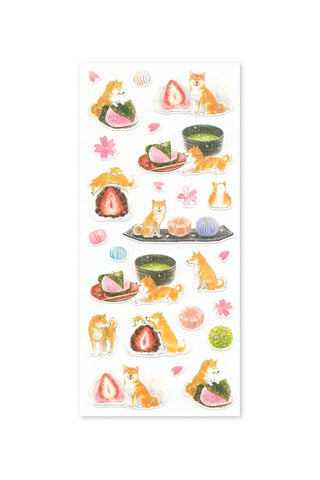 Sticker sheet with cartoon dogs and dessert and tea items on a white background