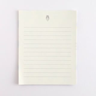 Lined pages with shoebill illustration on top