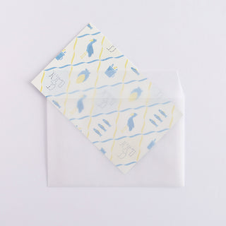 Folded paper with shoebill design sliding into envelope