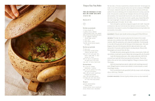 Bowl of soup with a lid on a textured surface next to text on a white background