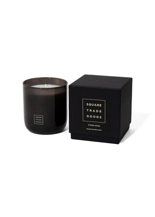 Black candle in a box with 'Square Trade Goods' branding on a white background