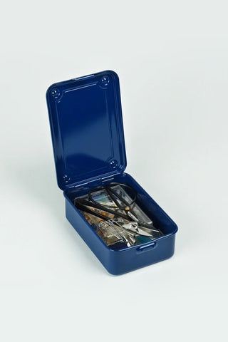 Blue metal storage box with keys inside on a white background