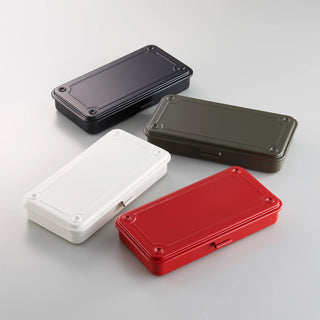Four trunk toolboxes in black, dark gray, white, and red, stacked and angled.