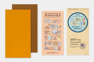 Traveler's notebook 2027 guide, stickers, and orange planner cover