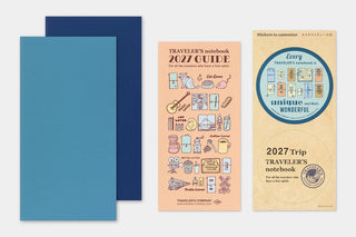 Planner set with blue covers, orange guide, and beige sticker packet
