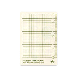 Grid passport writing mat with measurement scale and TRC logo label