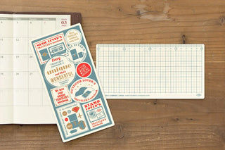 Grid writing mat with side ruler, shown next to a calendar page