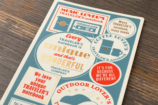 Teal writing mat cover with 'unique' quote and travel-themed icons