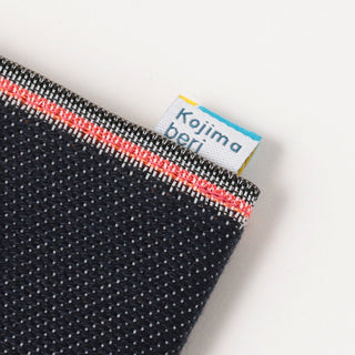 Close up of coin purse to show stitching