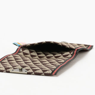 Opened brown and white coin purse on a white background