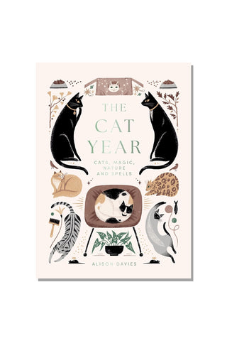 Book cover of 'The Cat Year' with illustrations of cats and cat-themed elements on a light pink background.