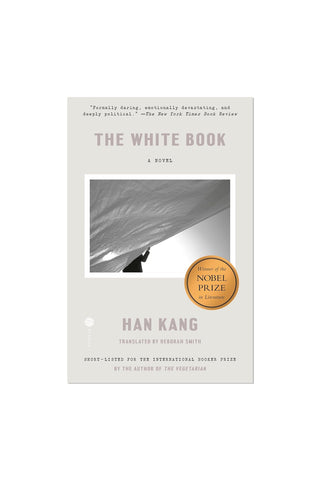 The White Book: A Novel by Han Kang, featuring a minimalist light gray cover with a central black-and-white photograph