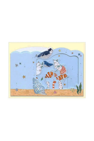 Illustration of cartoon cats in an aquarium scene with sand and stars underwater 
