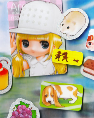 Sticker set featuring a cartoon girl, bear cutout, dog scene, and grapes design