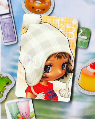 Cartoon sticker of a girl in a white hoodie and red dress, rounded cutout