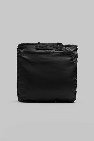 Black helmet bag front view with top handle and rectangular padded body