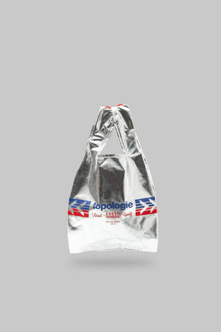 Mini metallic silver tote bag, angled view, gathered top and printed front band