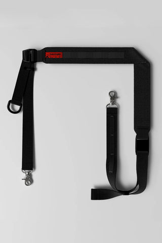 Black utility sling bag with adjustable straps and metal clips