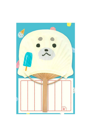 Fan-shaped card with a cartoon seal design on a blue background