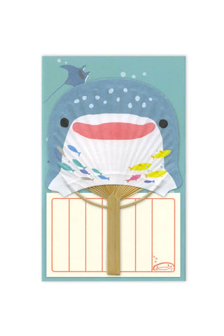 Whale-themed fan with colorful design on a white background