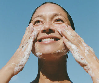 Ursa Major face wash foam on hands during cleansing