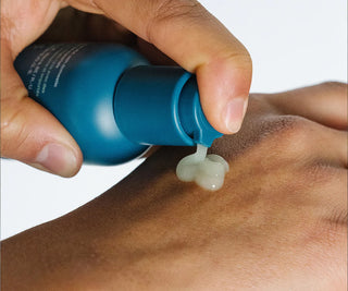 Person pumping the Ursa Major Forest Water Hyaluronic Serum on their hand