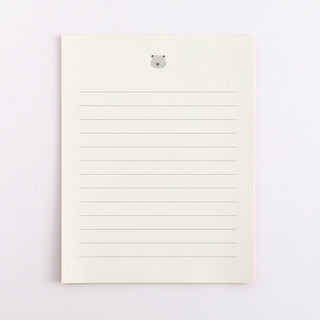 Lined pages with a small wombat illustration on a light gray background