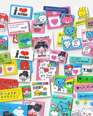 MONANBEAR character sticker assortment on squares, hearts, and blue/pink cartoon icons