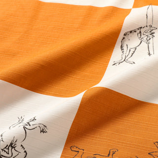Fabric with printed illustrations of animals on an orange and white background