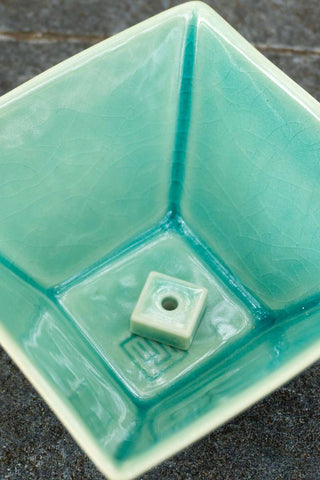 Green glazed incense burner bowl corner hole detail with square insert