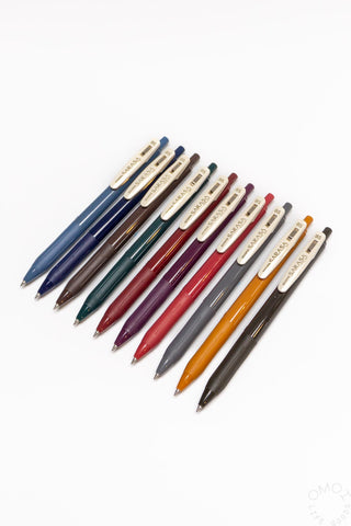 Set of multicolored pens on a white background