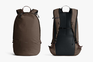 Brown backpacks on a white background, one showing front and other showing back