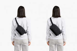 Person wearing a black crossbody bag from behind to show size comparison on a white background