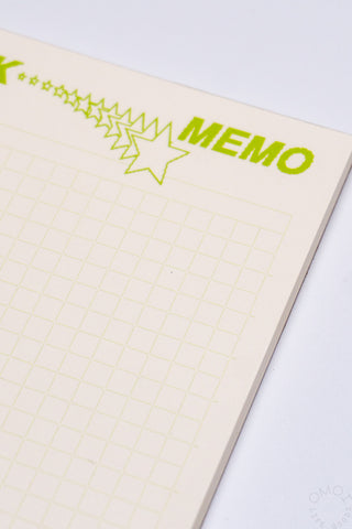 Memo pad with star design and 'MEMO' text on a light background