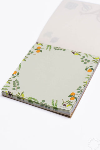 Memo pad with floral design on a white background