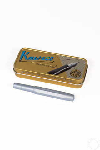 A Kaweco metal tin with a light blue fountain penon a white background.