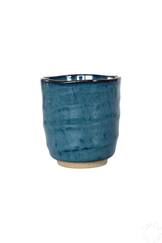 Kinyou dark blue ceramic teacup with speckled glaze and rounded rim