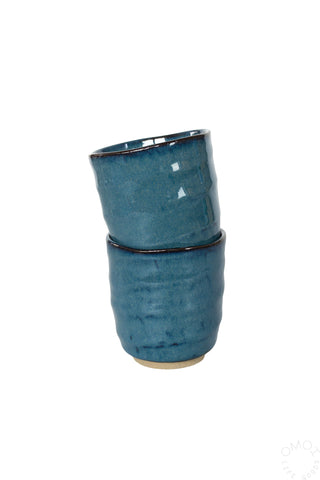 Stacked Kinyou dark blue ceramic teacups with glossy rim and textured glaze