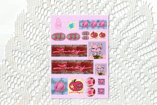 Lucky in Love pink sticker sheet on a white lace background