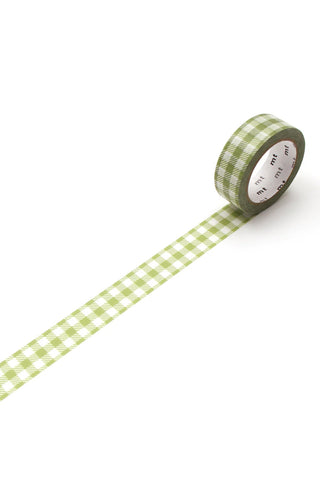 Green checkered tape rolled out on a white background