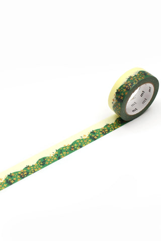 Washi tape with flowers on bushes rolled out on white background