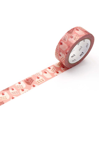 Roll of pink washi tape with a cake pattern on a white background