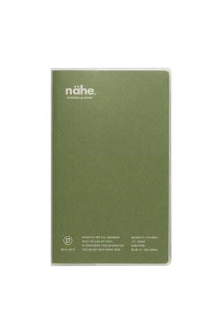 A planner with a green cover featuring the 'nähe' brand logo in white at the top left, set against a plain white background.