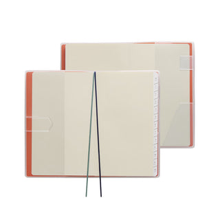 Planner interior to show features with two ribbon bookmarks, pen loop, monthly tabs, and corner pocket for small items