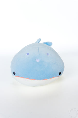 Blue whale shark plush on a white background