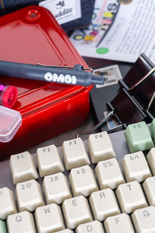 Close-up of Zento pen on a red toolbox with a keyboard