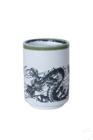 Oribe Ink Dragon teacup, light blue ceramic with green rim and dragon artwork